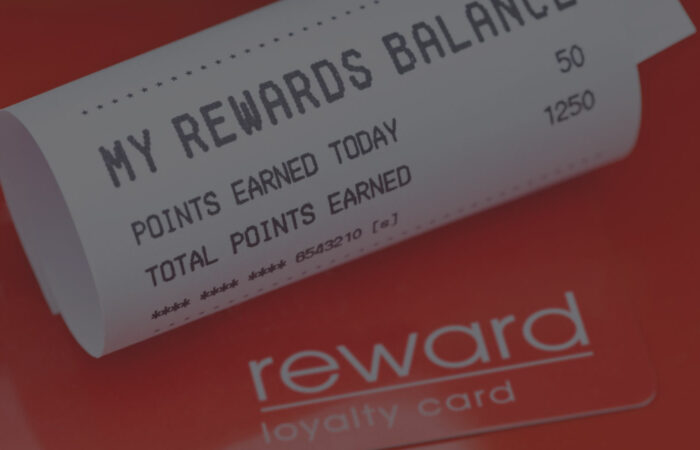 A loyalty rewards card and a receipt showing the points balance.